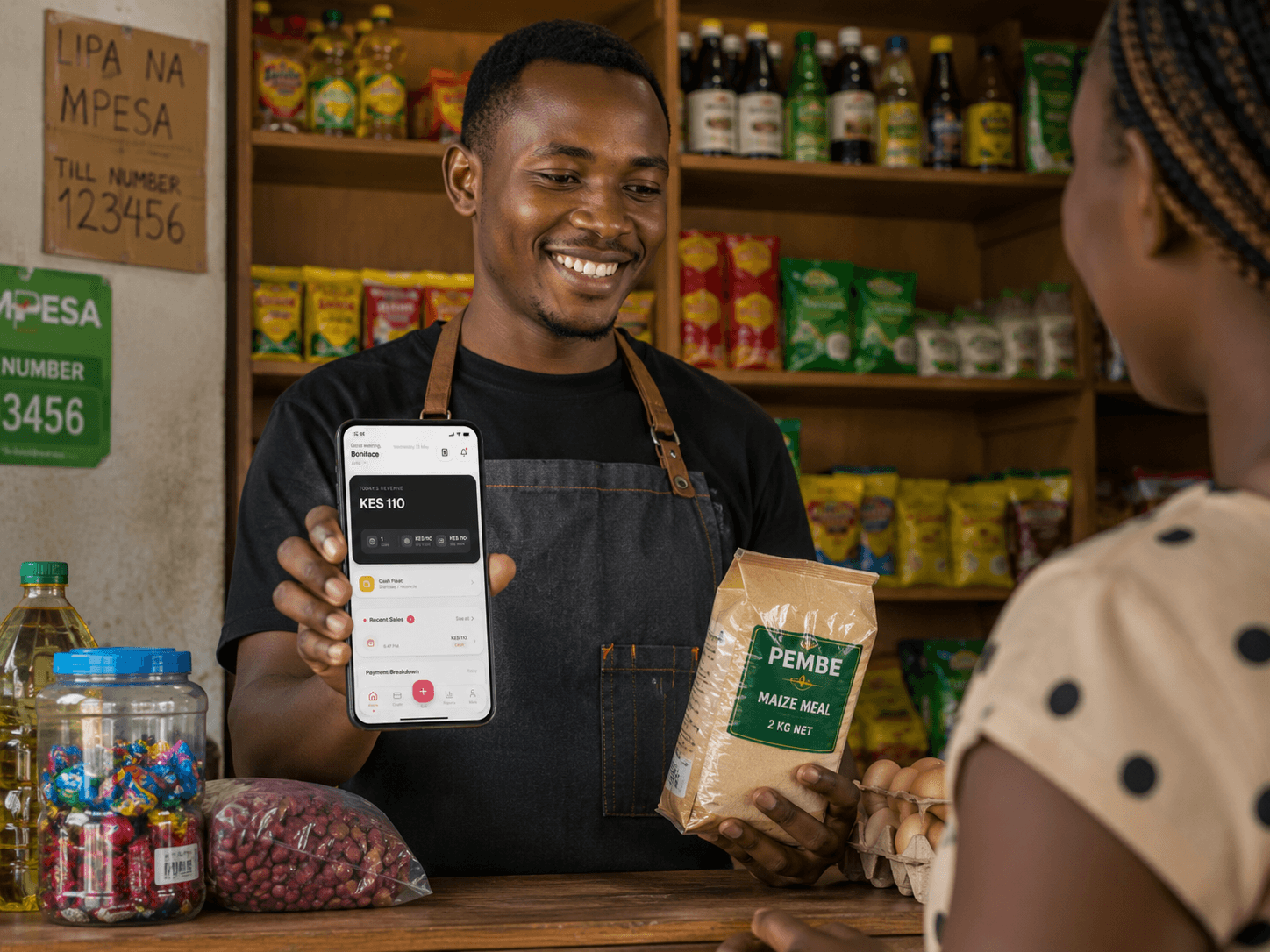 A DukaSale support team member on a call with a shop owner